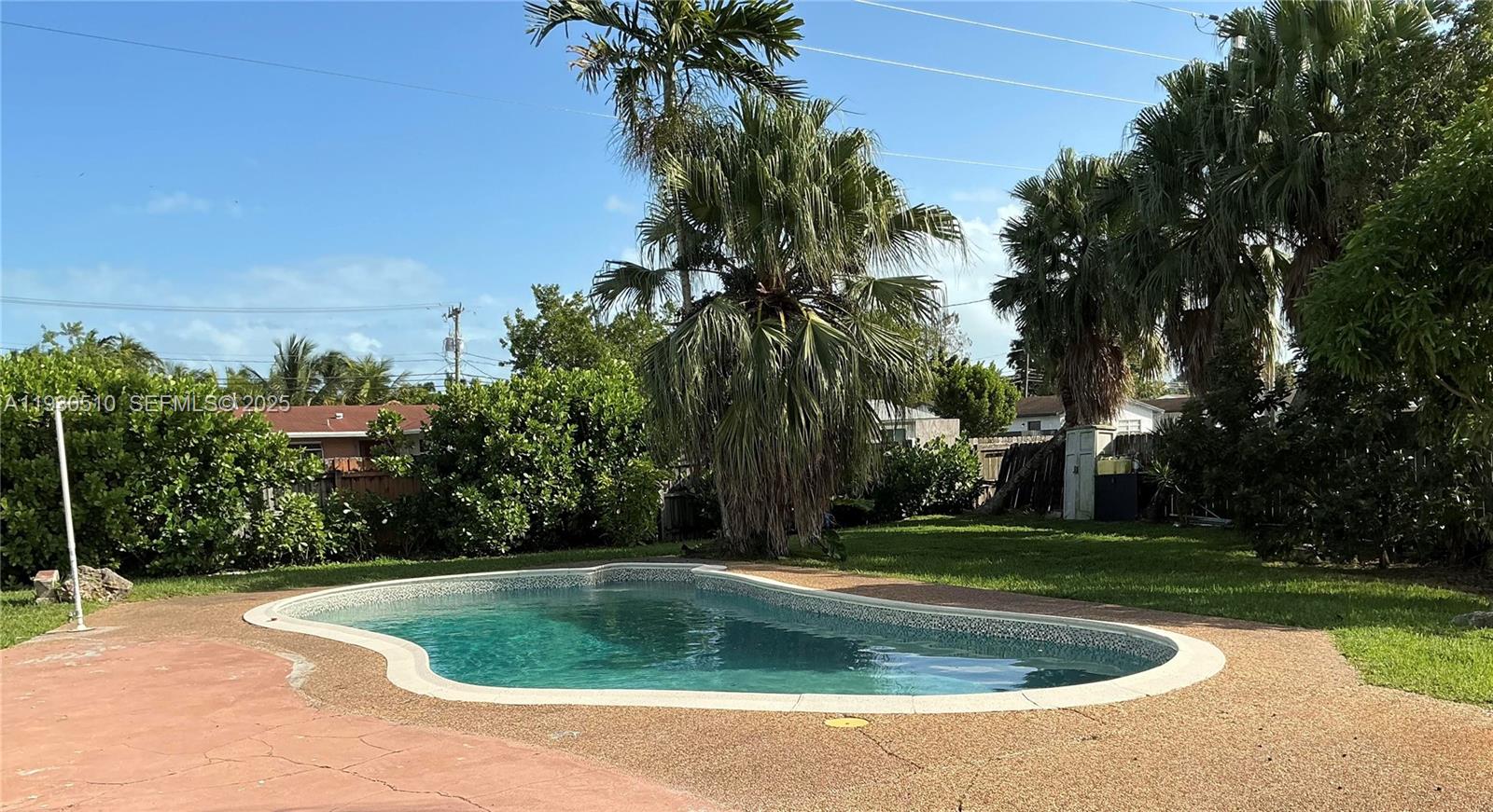 9700 Southwest 189th Street Cutler Bay, FL 33157 - Photo 17 of 21 a view of a fountain in front of a house