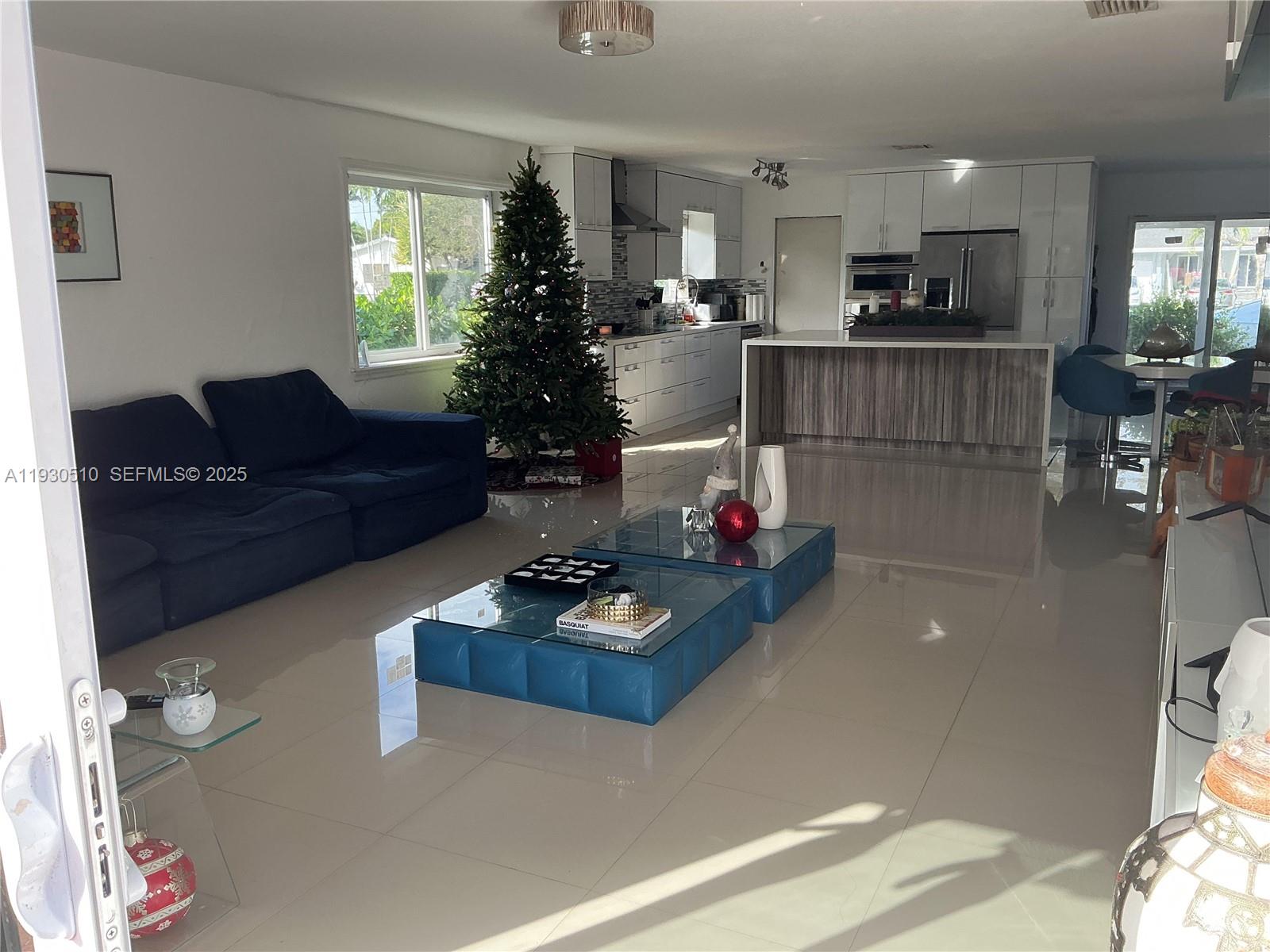 9700 Southwest 189th Street Cutler Bay, FL 33157 - Photo 4 of 21 a living room with furniture and a table