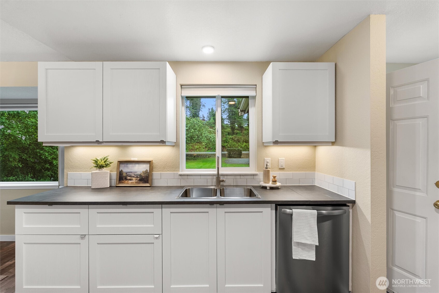 24711 Florence Acres Road Monroe, WA 98272 - Photo 15 of 33 a kitchen with granite countertop a sink window and cabinets