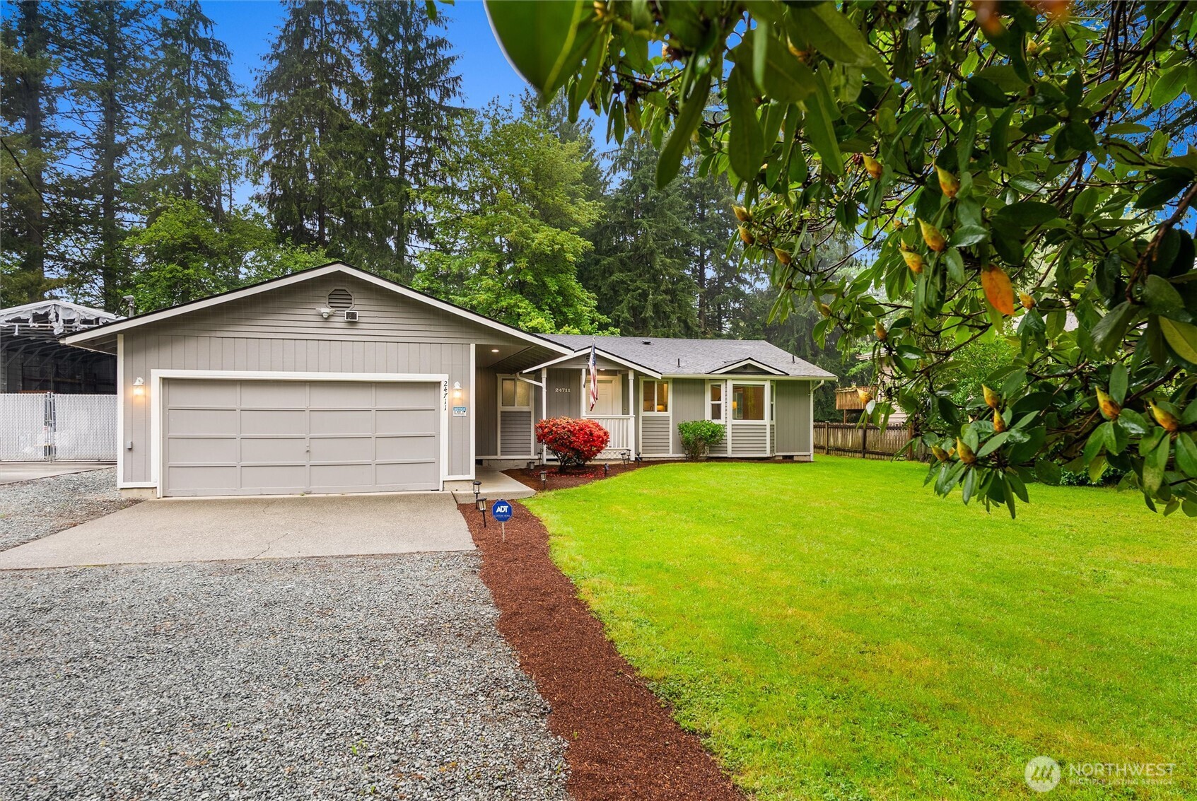 24711 Florence Acres Road Monroe, WA 98272 - Photo 2 of 33 a front view of a house with a yard and garage