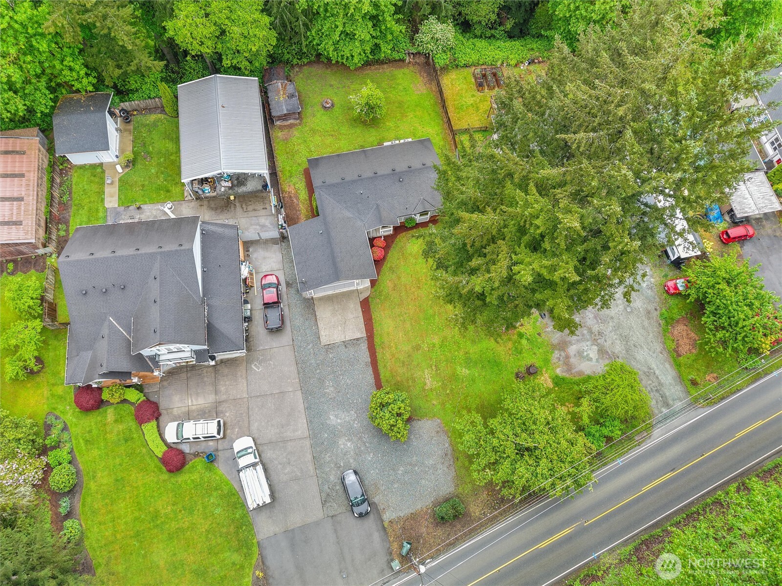 24711 Florence Acres Road Monroe, WA 98272 - Photo 31 of 33 an aerial view of a house with a garden and a large tree