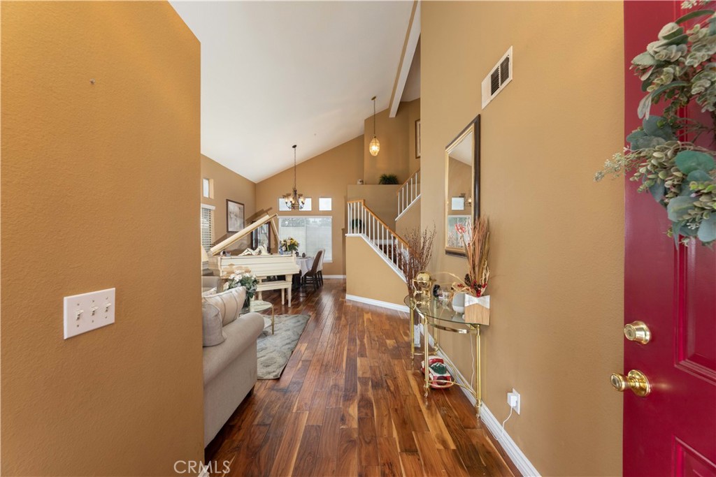 11541 Plane Tree Road Fontana, CA 92337 - Photo 4 of 33 a view of entryway and hall with wooden floor