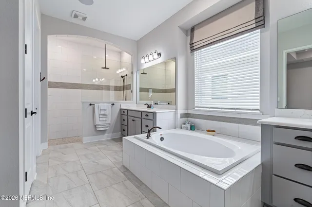 a bathroom with a sink a toilet and a bathtub