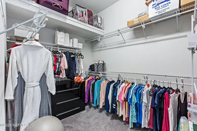 a view of an outdoor dining space with a table and chairs