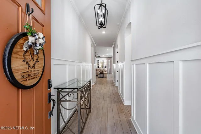 a living room with furniture and a ceiling fan