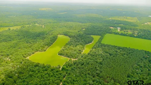 a view of a lake with a big yard