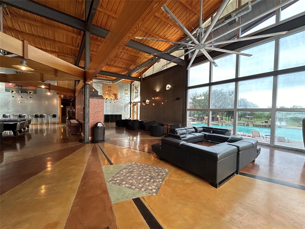 1190 Post Oak Road Gordon, TX 76453 - Photo 11 of 19 a living room with patio furniture and a floor to ceiling window