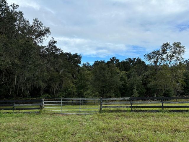 a view of a golf course with a lake