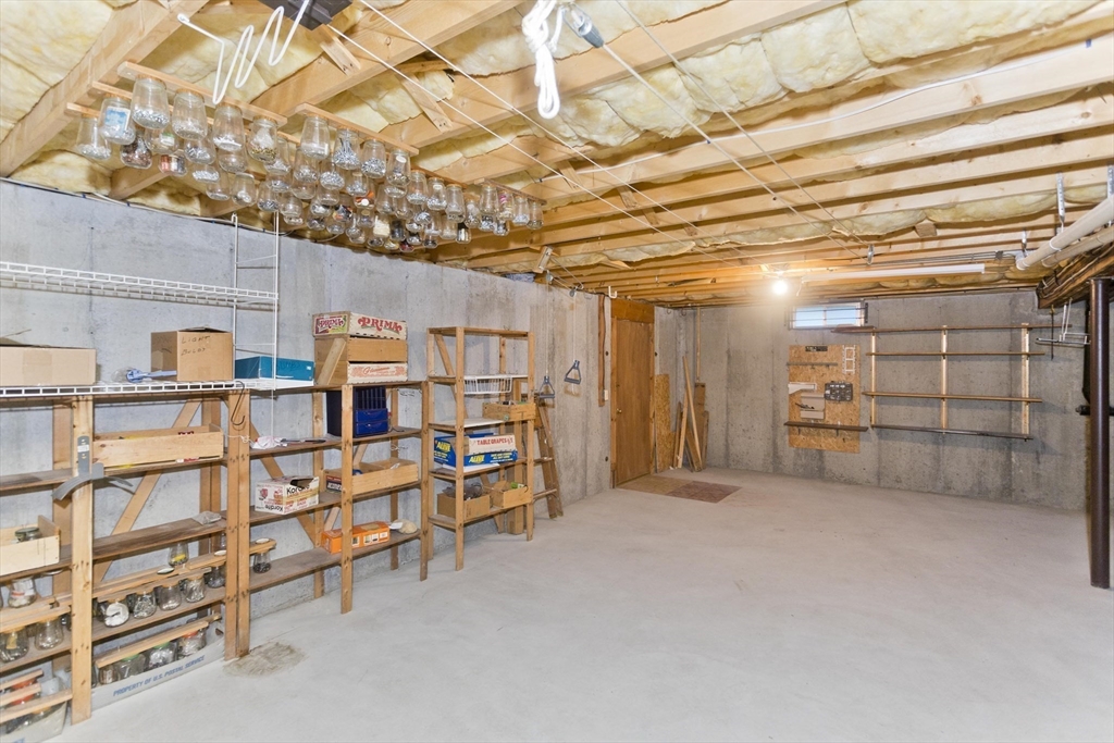 86 Beveridge Boulevard, Unit 86 Westfield, MA 01085 - Photo 11 of 16 a view of a room with racks on the wall
