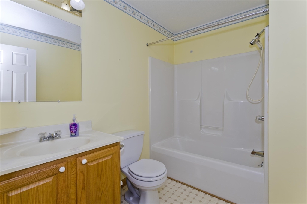 86 Beveridge Boulevard, Unit 86 Westfield, MA 01085 - Photo 10 of 16 a bathroom with a sink toilet and shower
