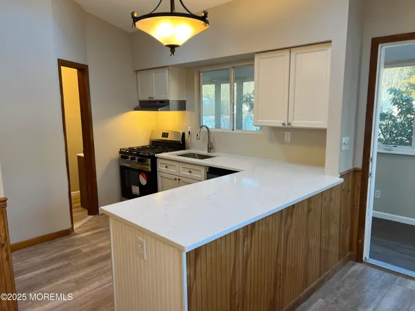 a kitchen with a sink and a refrigerator