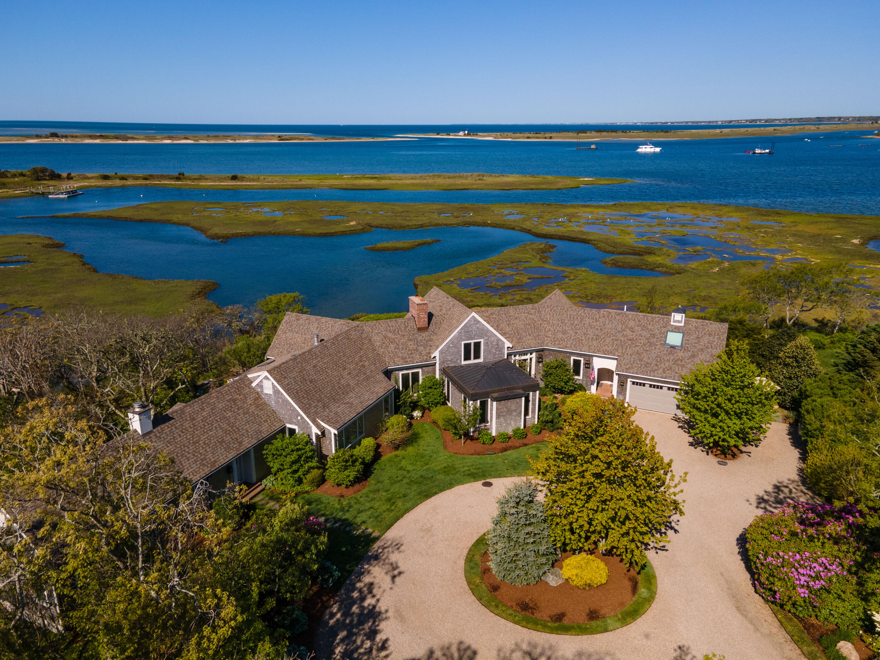 270 Stage Island Road Chatham, MA 02633 - Photo 3 of 63 an aerial view of a house with a ocean view