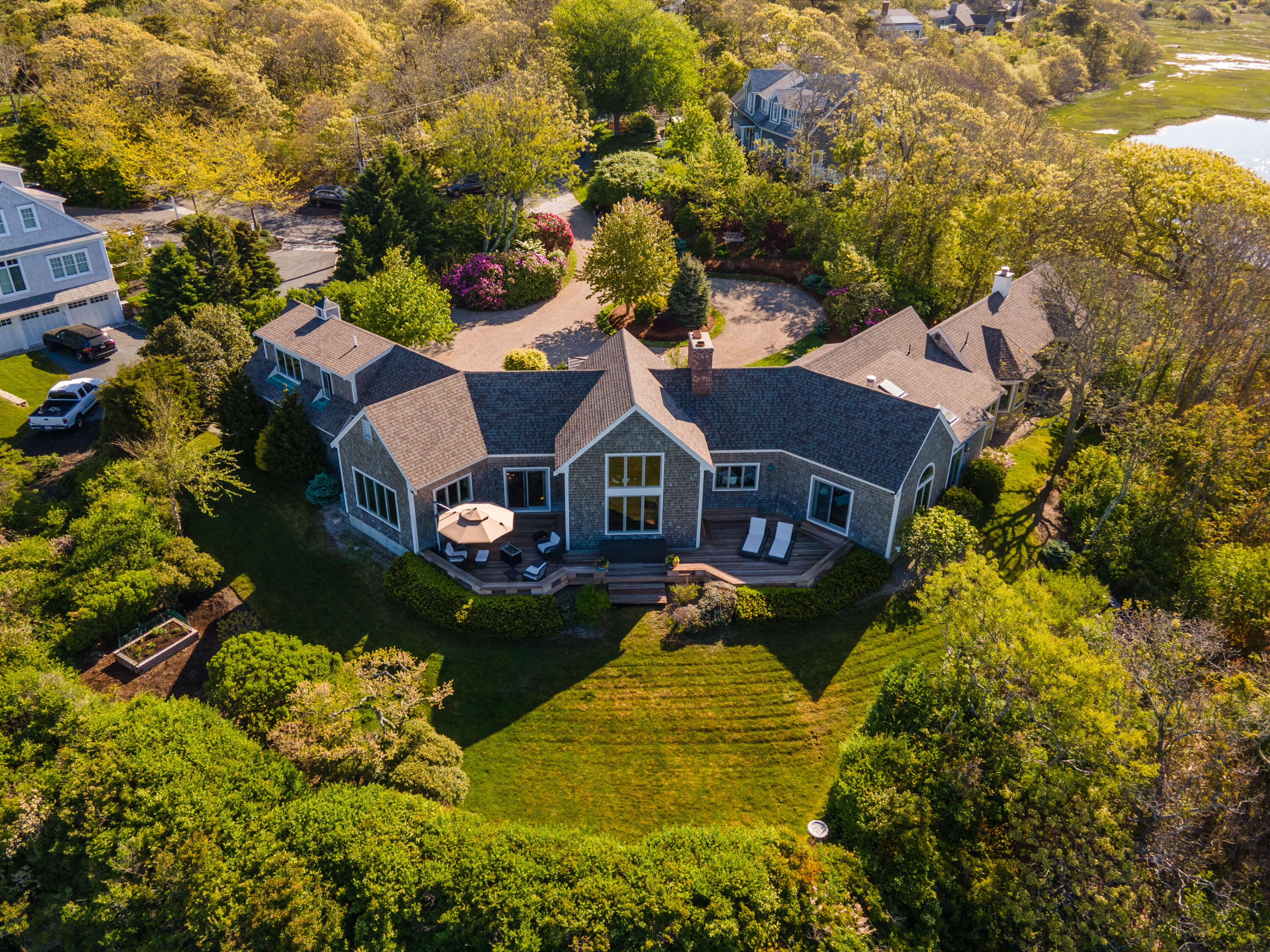 270 Stage Island Road Chatham, MA 02633 - Photo 5 of 63 a aerial view of a house with a yard basket ball court and outdoor seating