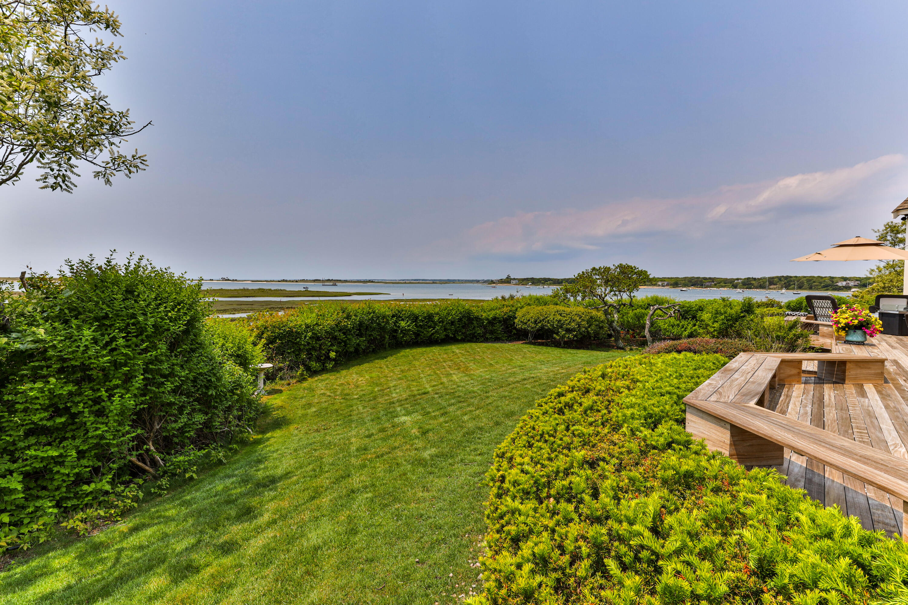 270 Stage Island Road Chatham, MA 02633 - Photo 51 of 63 a view of a swimming pool and a yard