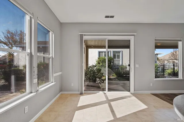 a kitchen with granite countertop a refrigerator and a stove