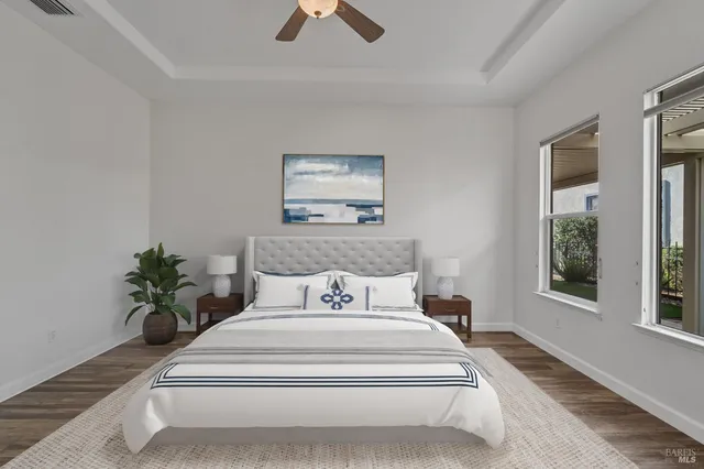a view of a room with wooden floor and a window