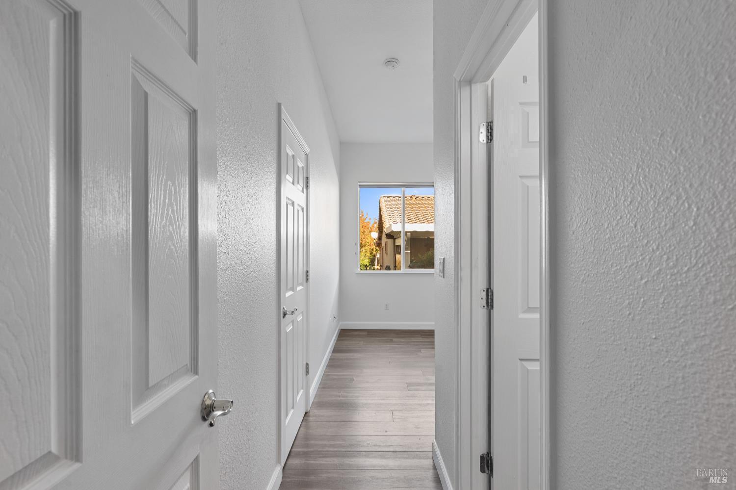 350 Canyon Spring Drive Rio Vista, CA 94571 - Photo 37 of 55 a view of a hallway with wooden floor and a bathroom