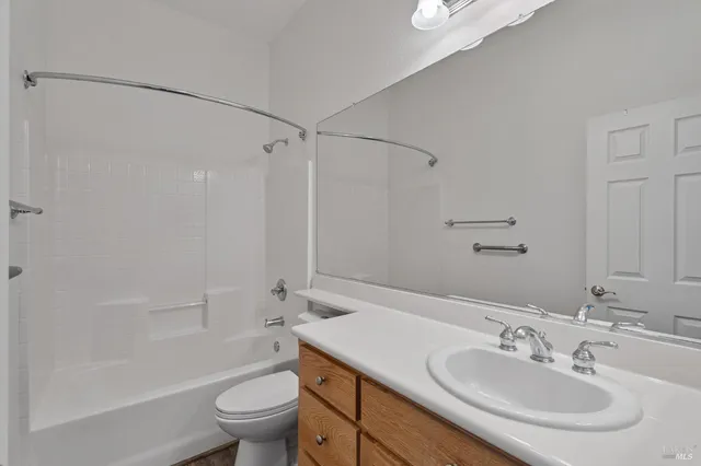 a view of storage and utility room with washer and dryer