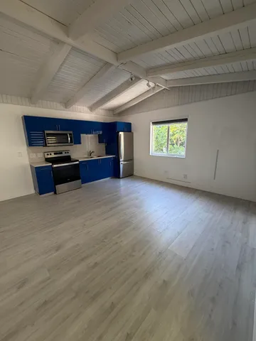 a view of kitchen with furniture and window