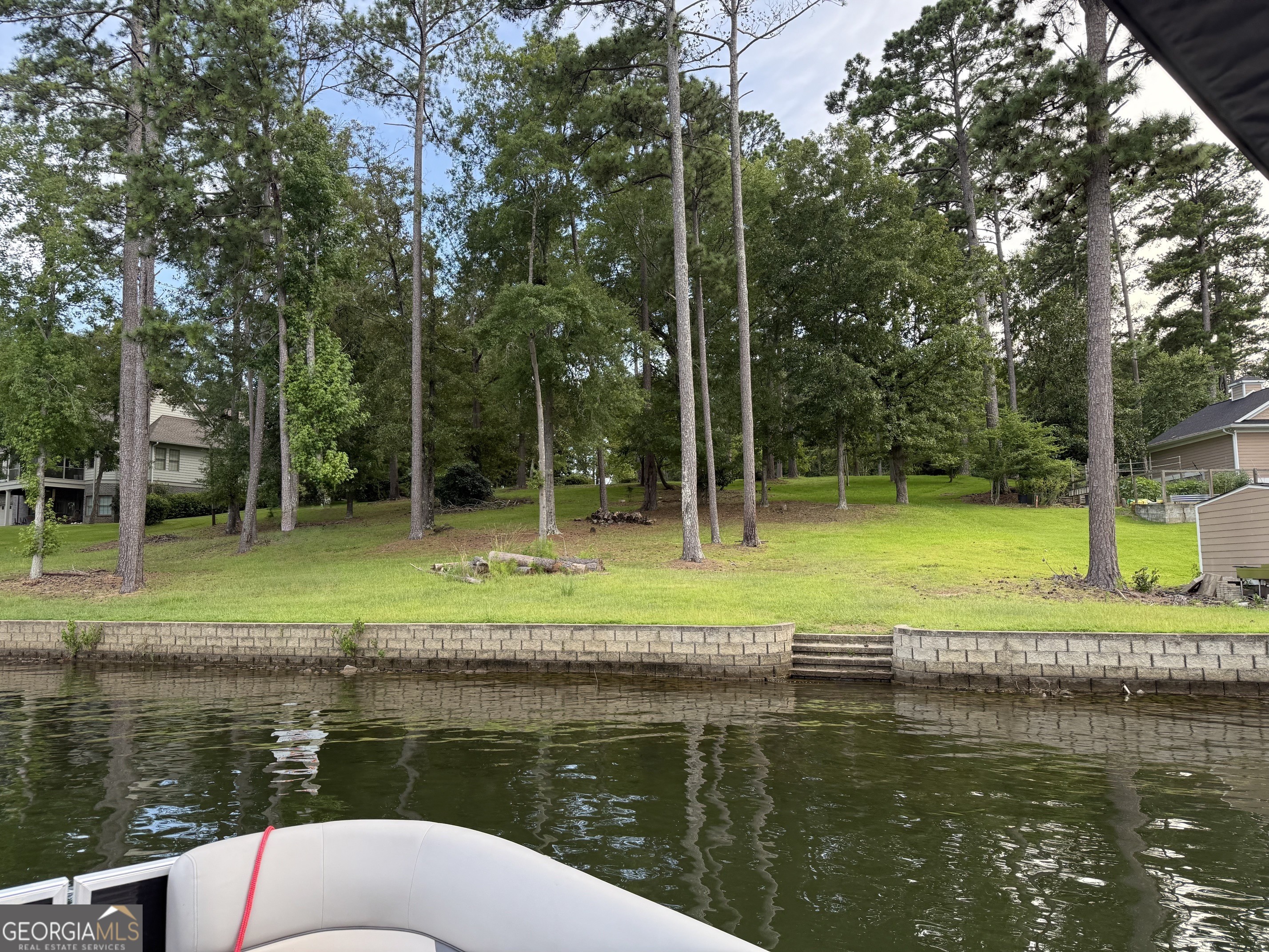 151 Bill Johnson Road Northeast Milledgeville, GA 31061 - Photo 2 of 27 a view of a lake with a house