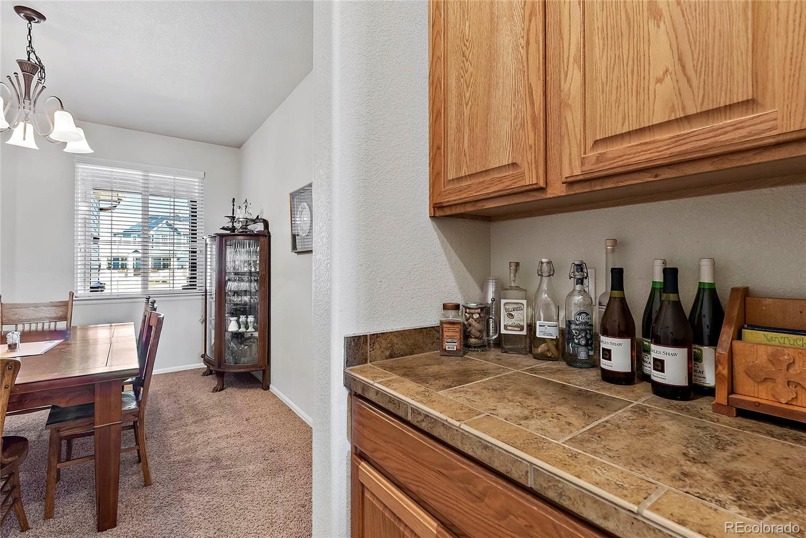 8006 Raspberry Drive Frederick, CO 80504 - Photo 12 of 27 a kitchen with stainless steel appliances granite countertop a sink and cabinets