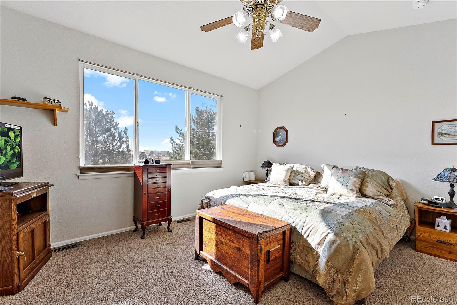 8006 Raspberry Drive Frederick, CO 80504 - Photo 14 of 27 a bed sitting in a bedroom next to a window