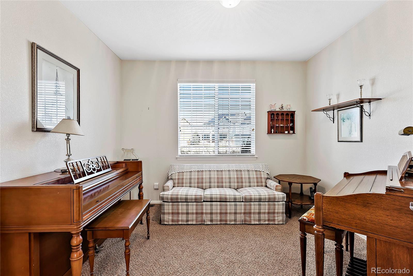 8006 Raspberry Drive Frederick, CO 80504 - Photo 21 of 27 a bedroom with furniture and window