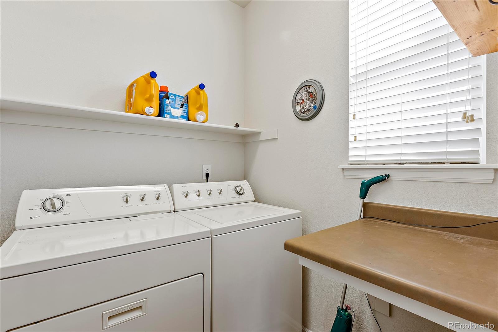 8006 Raspberry Drive Frederick, CO 80504 - Photo 22 of 27 a utility room with dryer and washer