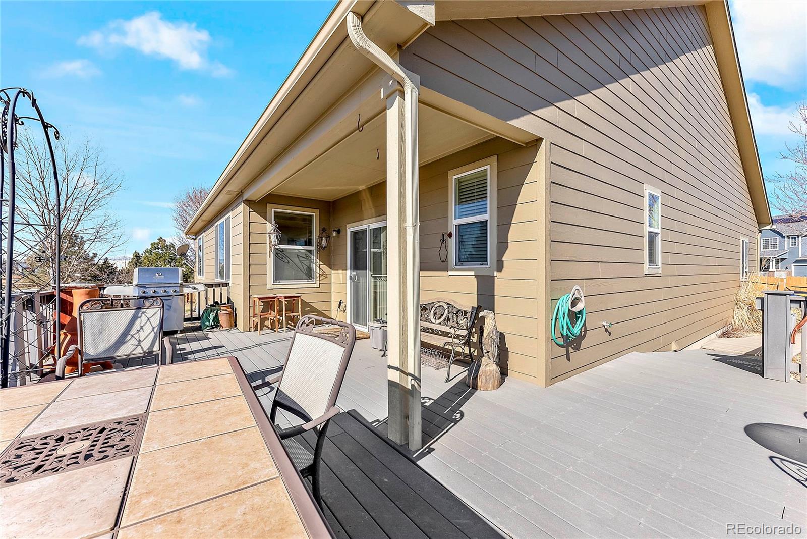 8006 Raspberry Drive Frederick, CO 80504 - Photo 24 of 27 front view of a house with a patio