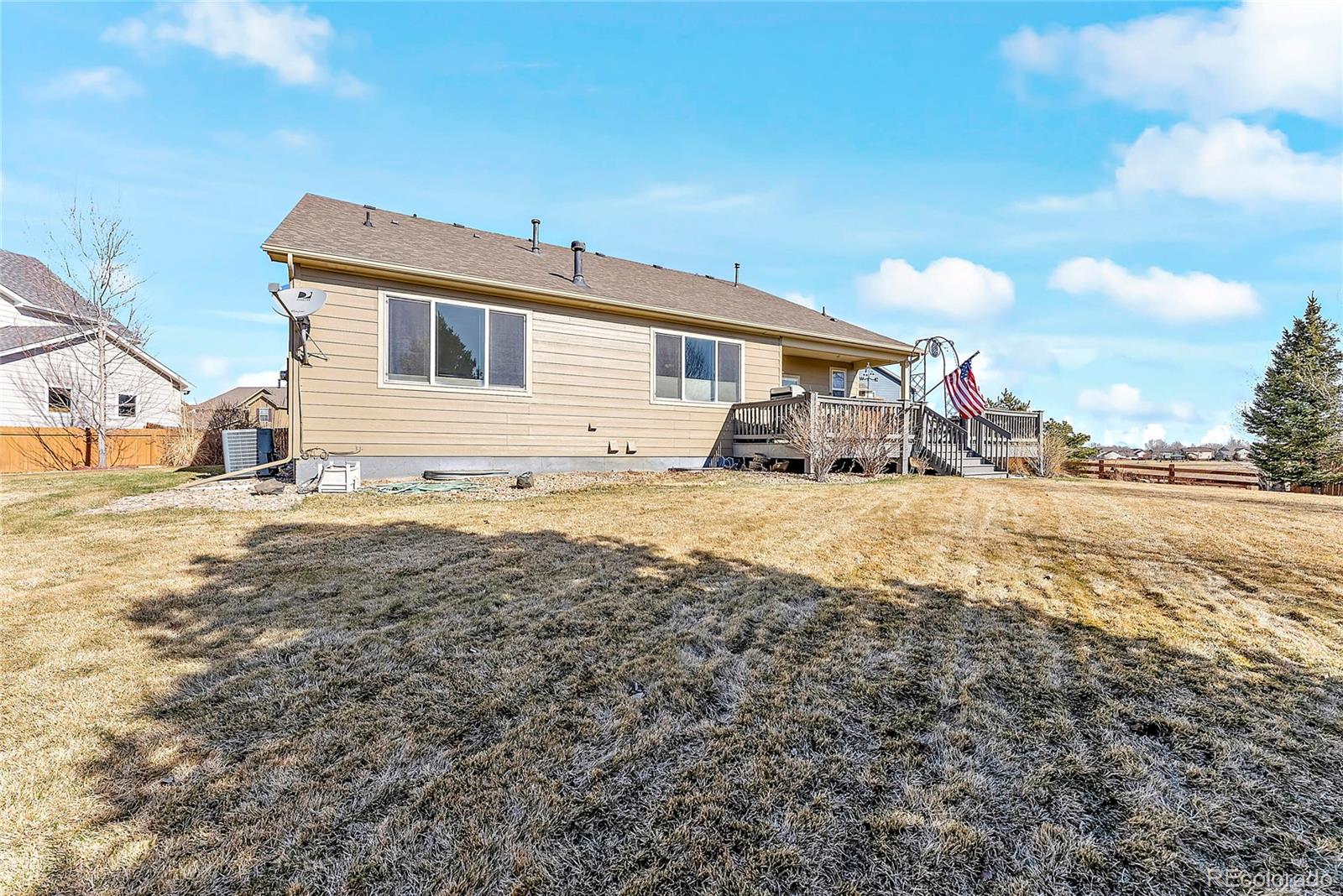8006 Raspberry Drive Frederick, CO 80504 - Photo 26 of 27 a view of a house with a yard