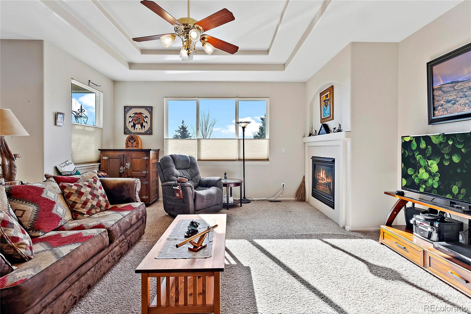 8006 Raspberry Drive Frederick, CO 80504 - Photo 3 of 27 a living room with furniture fireplace and a window