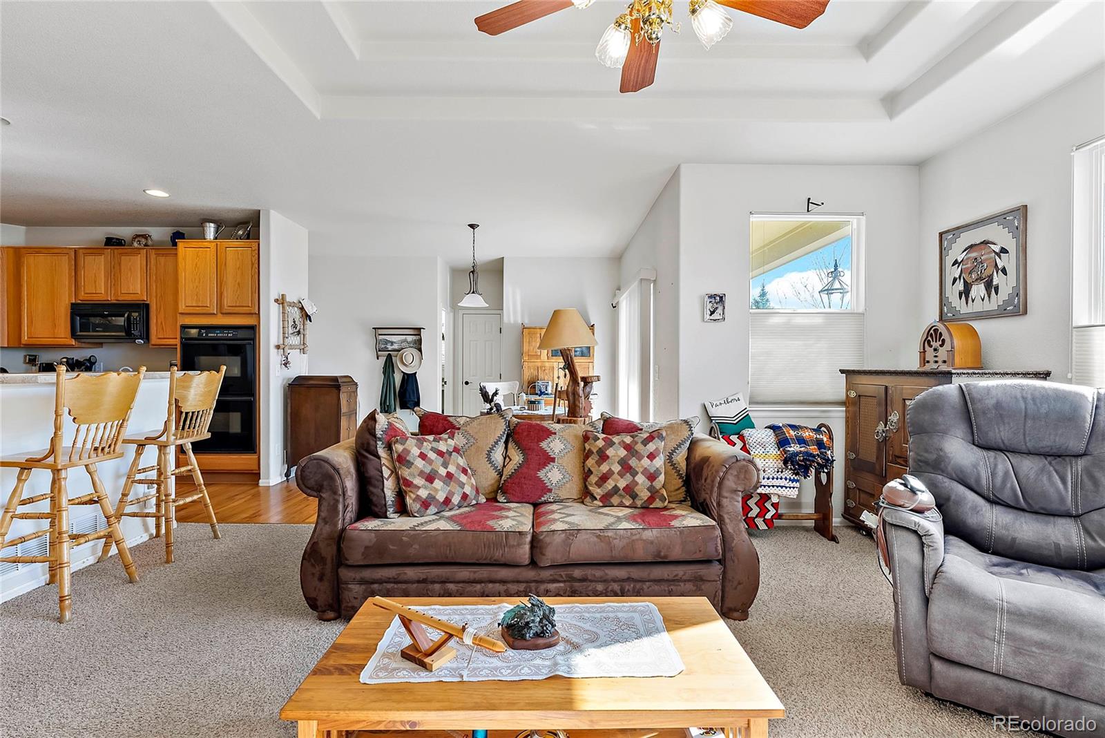 8006 Raspberry Drive Frederick, CO 80504 - Photo 4 of 27 a living room with furniture a rug and a fireplace