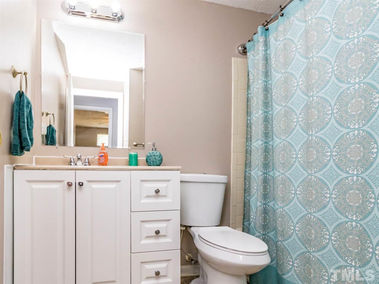 7251 Shellburne Drive Raleigh, NC 27612 - Photo 14 of 21 a bathroom with a granite countertop sink mirror vanity and toilet
