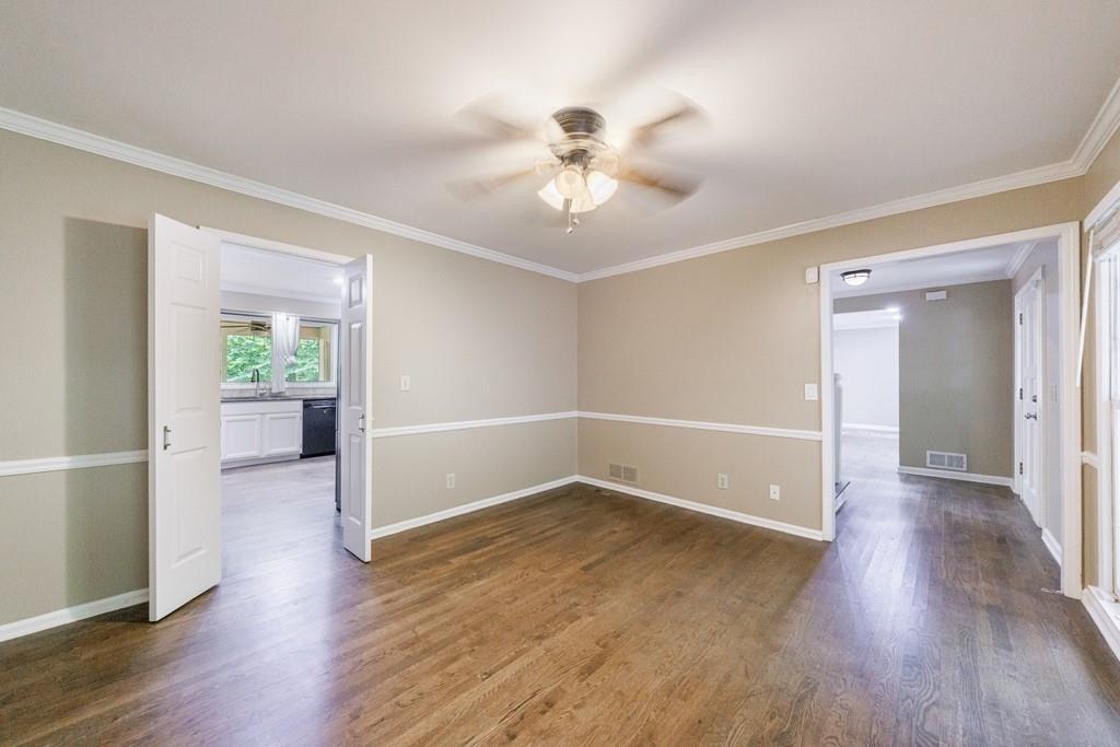 10565 Shallowford Road Roswell, GA 30075 - Photo 13 of 18 wooden floor in an empty room with a window