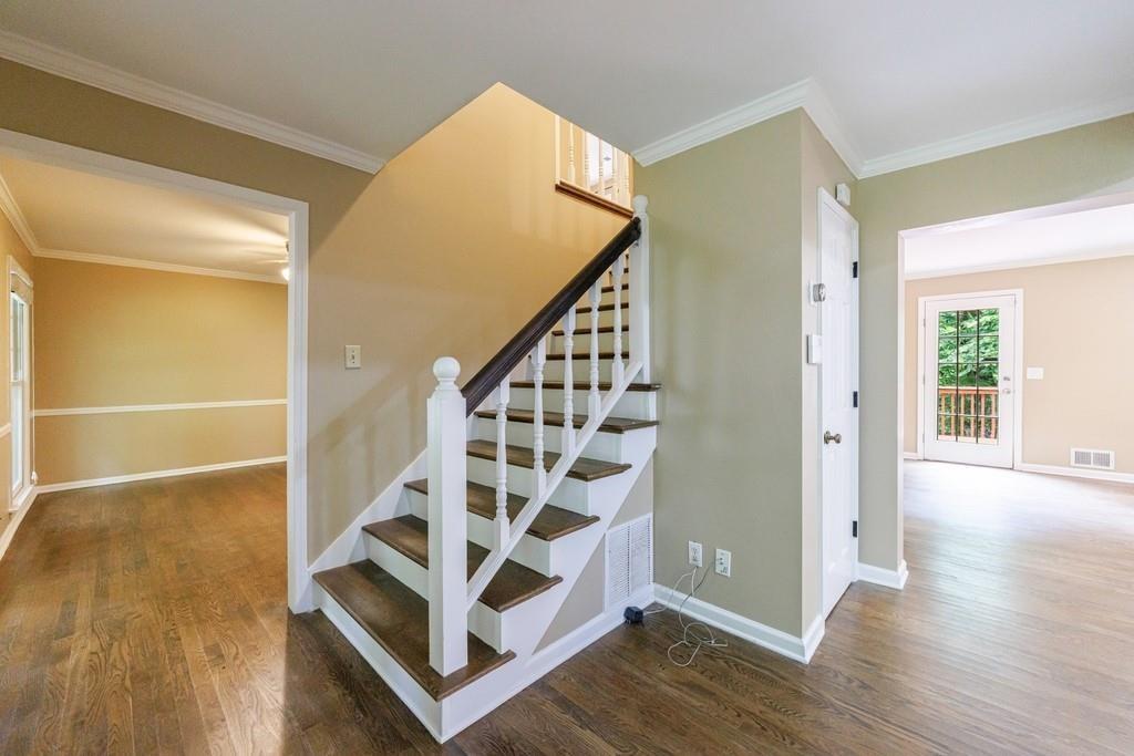 10565 Shallowford Road Roswell, GA 30075 - Photo 14 of 18 a view of entryway with wooden floor and stairs