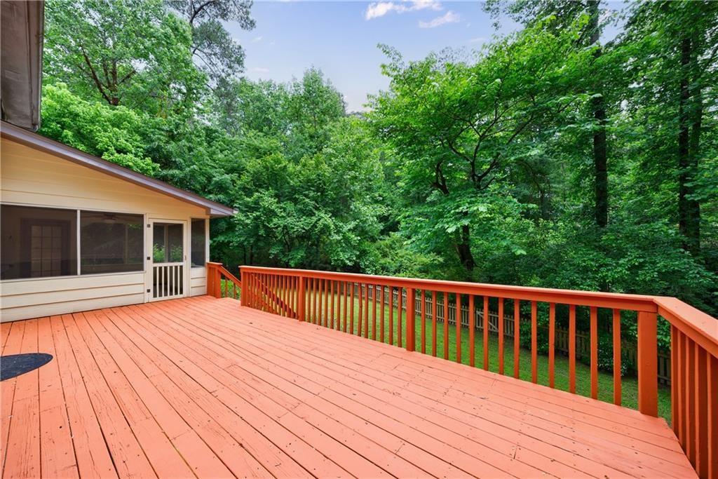 10565 Shallowford Road Roswell, GA 30075 - Photo 18 of 18 a balcony with wooden floor and fence
