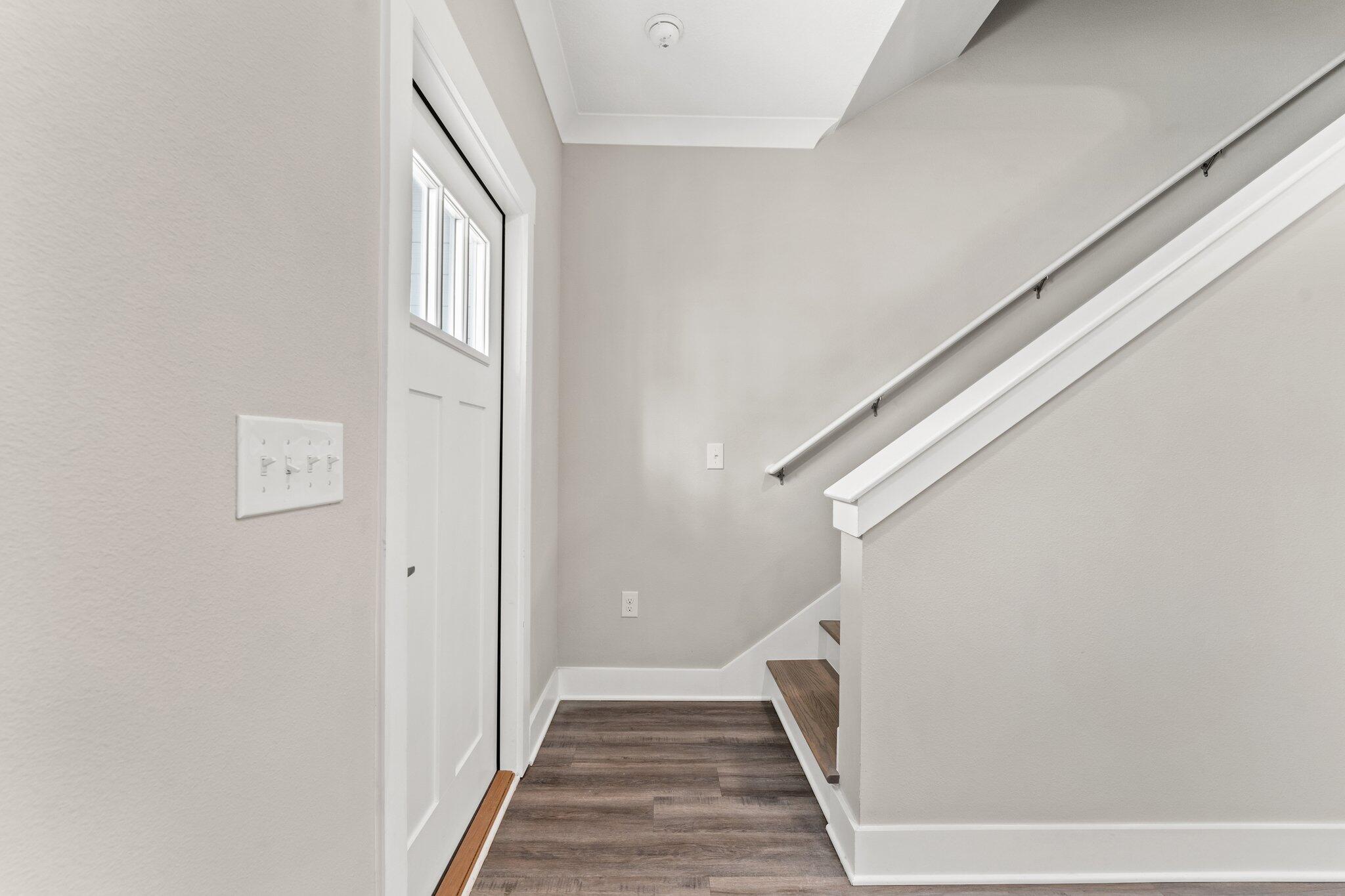 352 North Sand Palm Road, Unit VISTA Freeport, FL 32439 - Photo 12 of 29 a view of a hallway with wooden floor and staircase