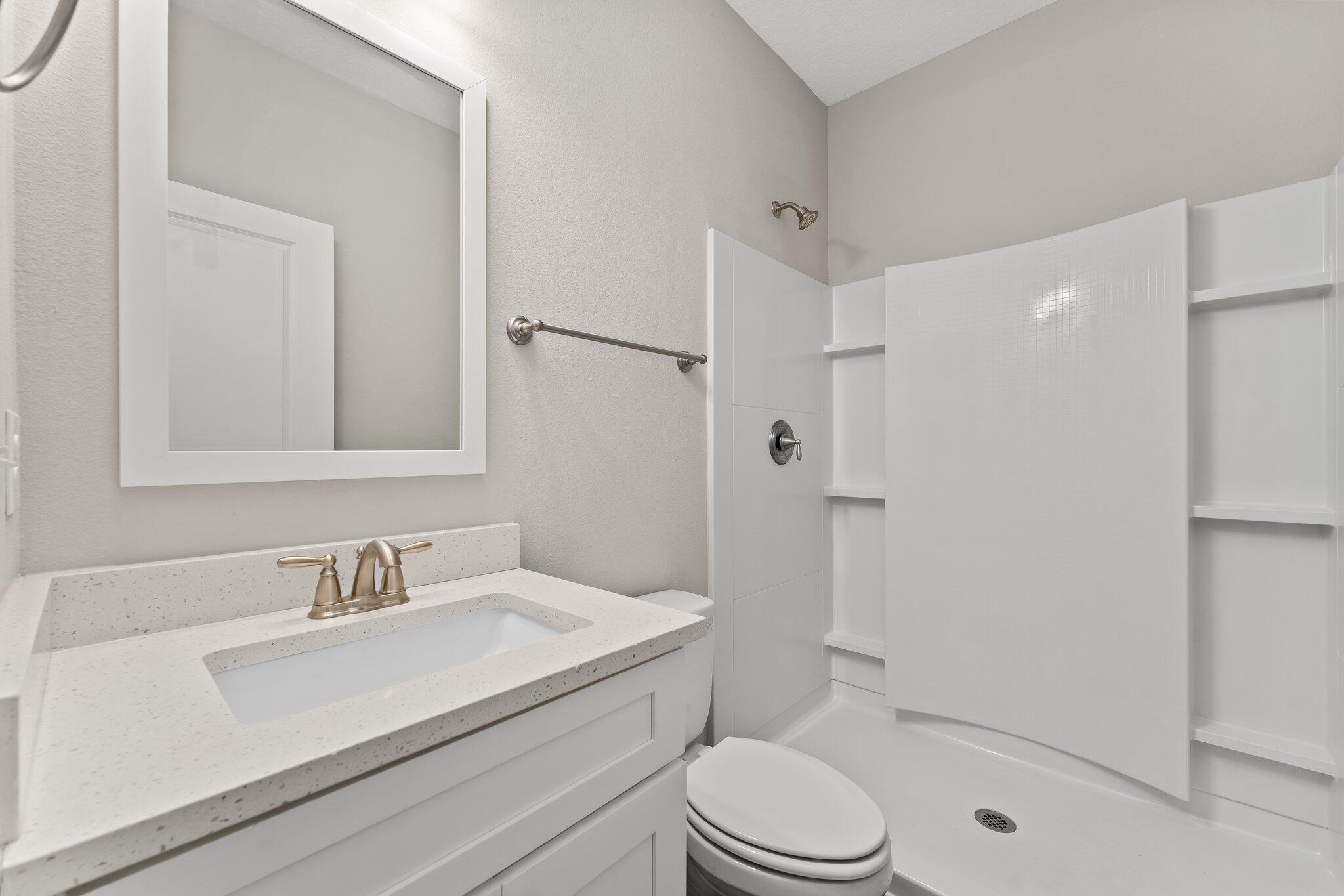 352 North Sand Palm Road, Unit VISTA Freeport, FL 32439 - Photo 14 of 29 a bathroom with a sink a toilet and shower