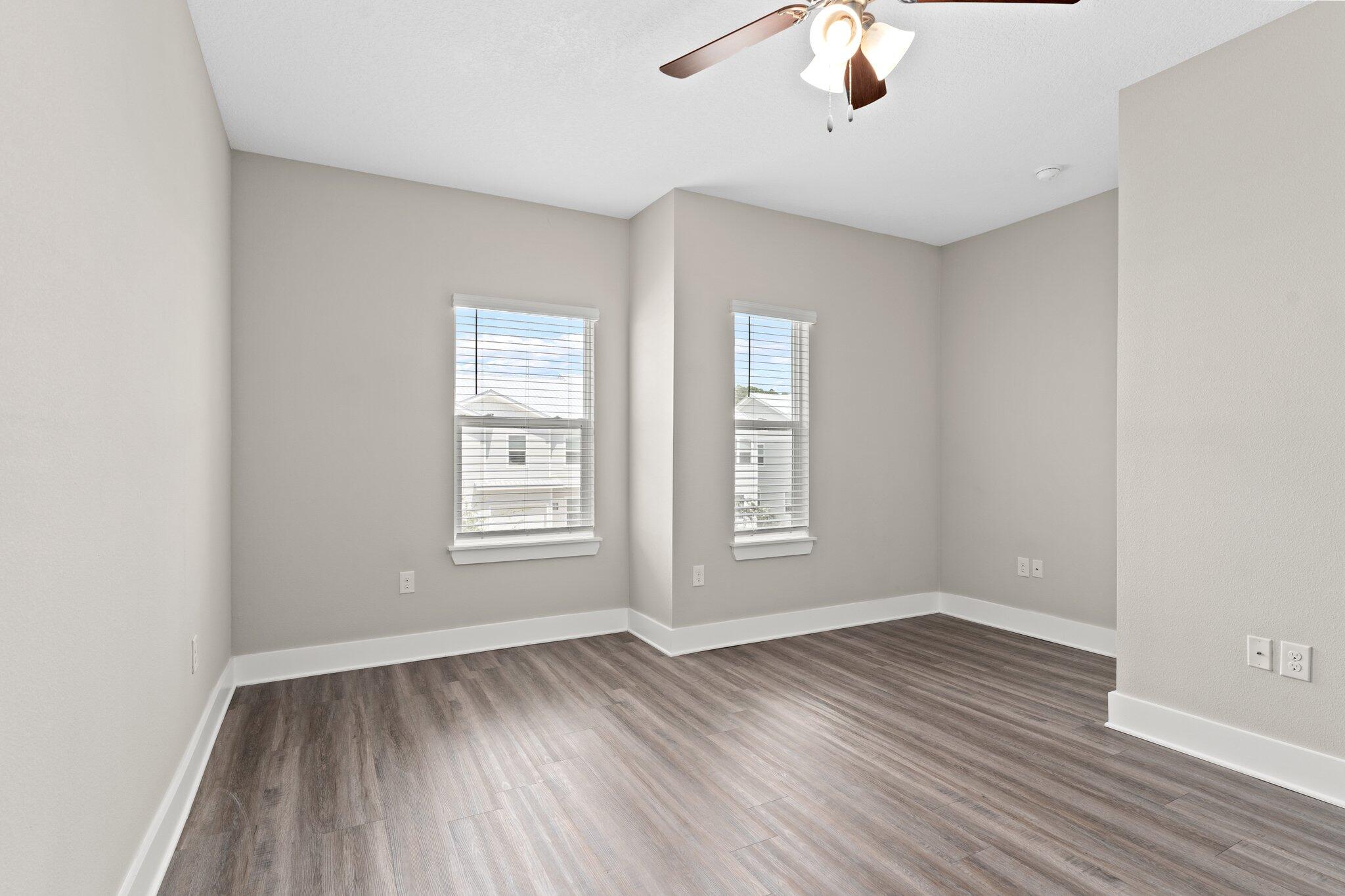 352 North Sand Palm Road, Unit VISTA Freeport, FL 32439 - Photo 16 of 29 wooden floor in an empty room with a window
