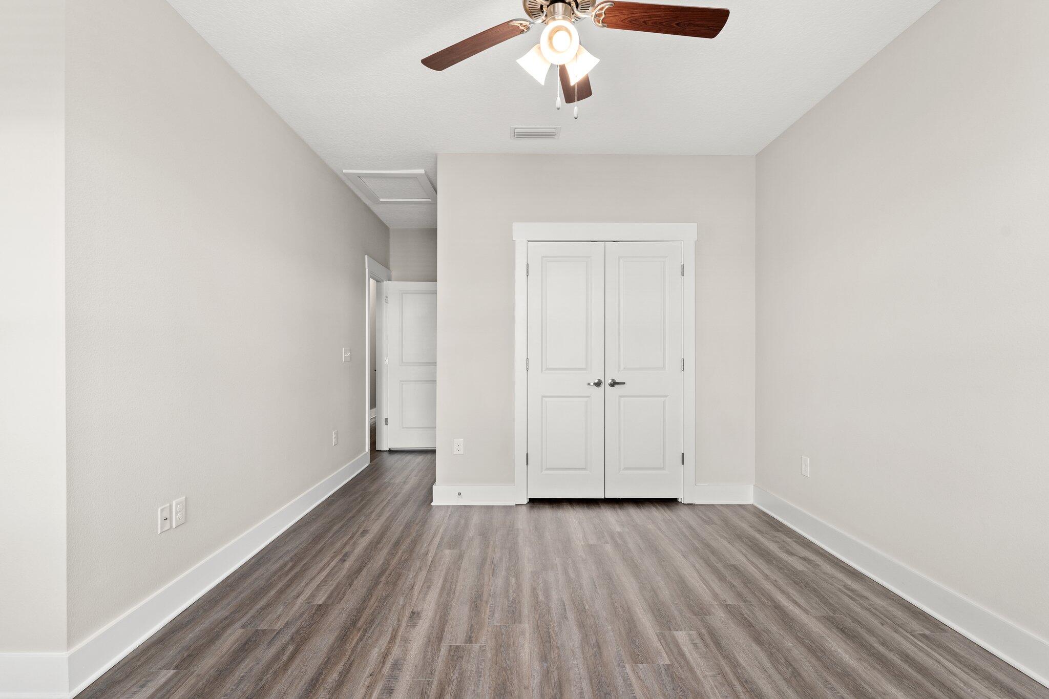 352 North Sand Palm Road, Unit VISTA Freeport, FL 32439 - Photo 17 of 29 wooden floor in an empty room with a window