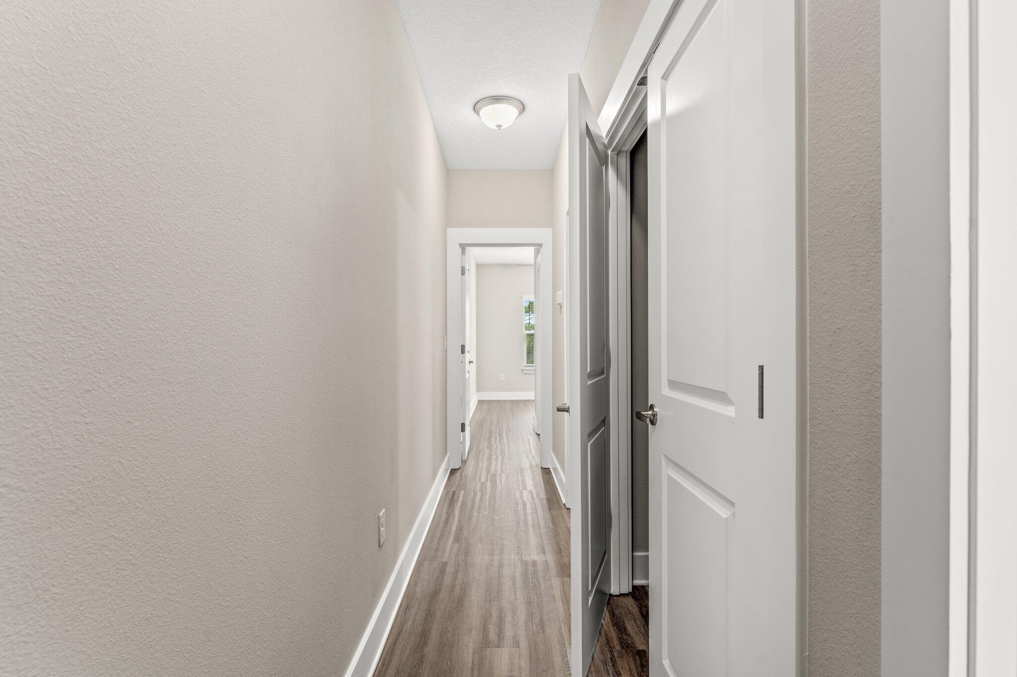 352 North Sand Palm Road, Unit VISTA Freeport, FL 32439 - Photo 18 of 29 a view of a bathroom from a corridor