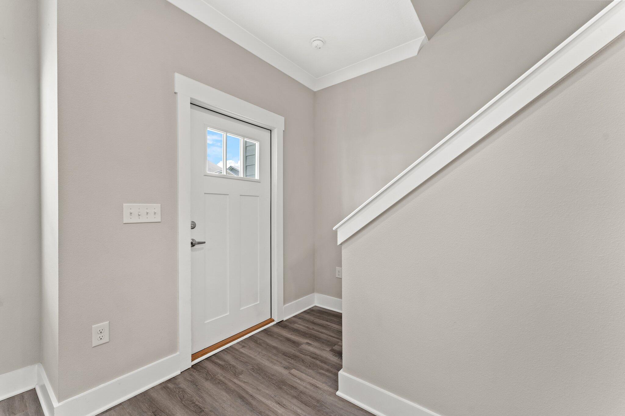 352 North Sand Palm Road, Unit VISTA Freeport, FL 32439 - Photo 2 of 29 a view of a hallway with wooden floor and staircase