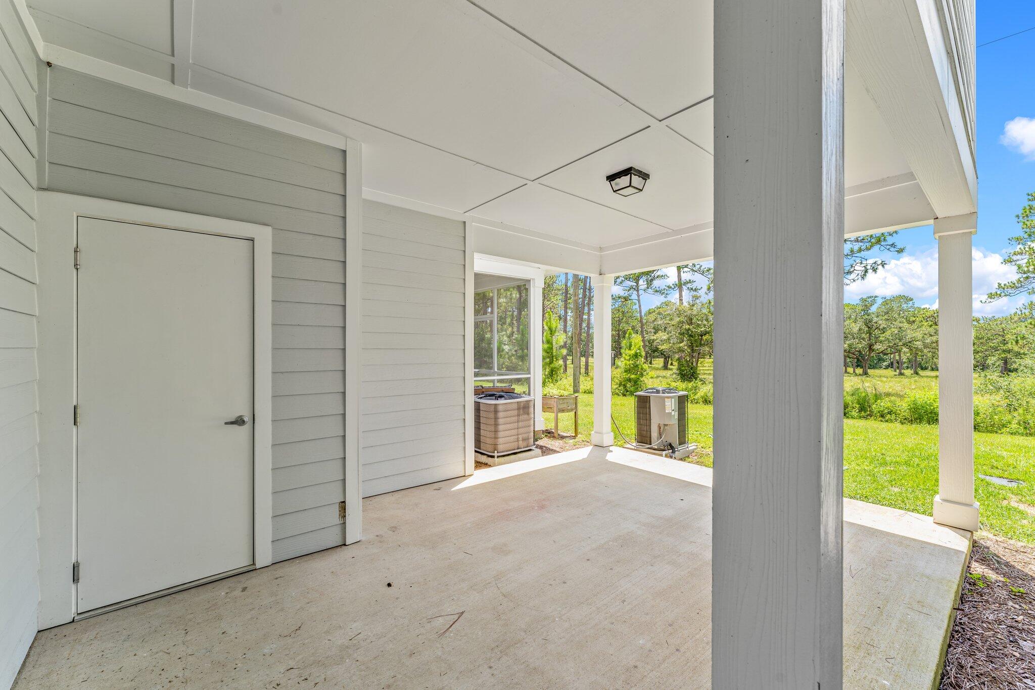 352 North Sand Palm Road, Unit VISTA Freeport, FL 32439 - Photo 26 of 29 a view of an empty room with large windows