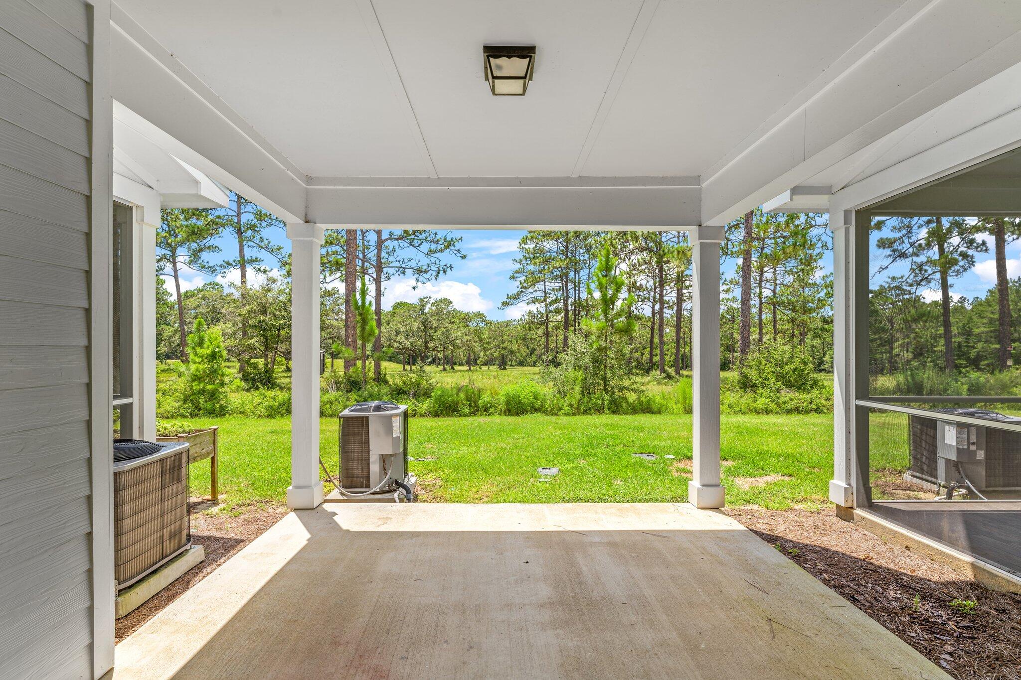 352 North Sand Palm Road, Unit VISTA Freeport, FL 32439 - Photo 28 of 29 a view of a garden with an outdoor space