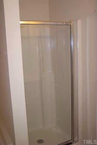 3539 Oneonta Avenue Raleigh, NC 27604 - Photo 6 of 10 a bathroom with a glass shower door