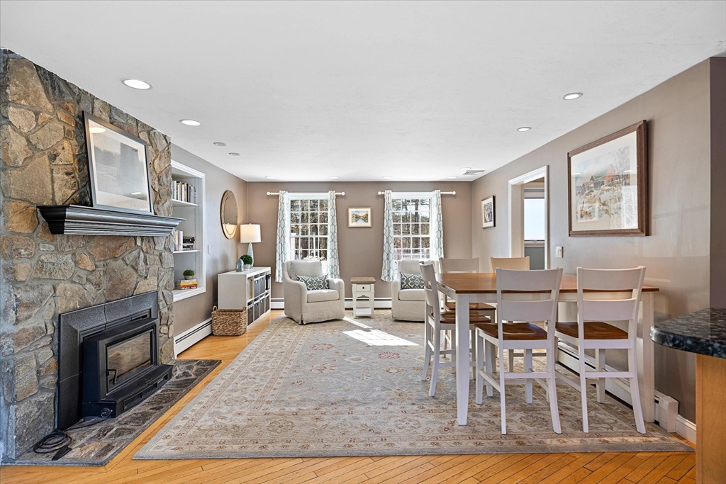 10 Spring Road Westborough, MA 01581 - Photo 12 of 42 a living room with furniture a fireplace and a large window