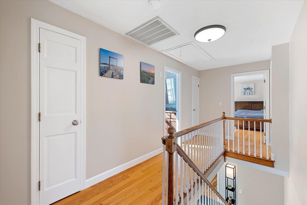 10 Spring Road Westborough, MA 01581 - Photo 18 of 42 a view of entryway with stairs and wooden floor