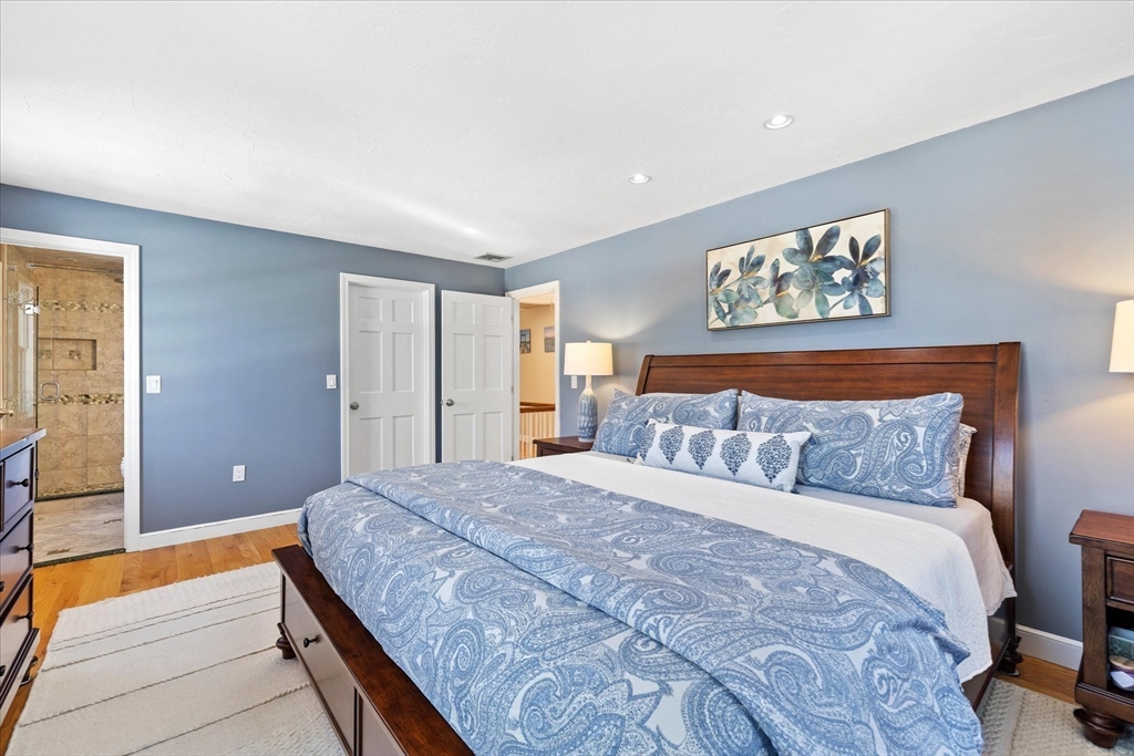 10 Spring Road Westborough, MA 01581 - Photo 20 of 42 a spacious bedroom with a bed and a couch