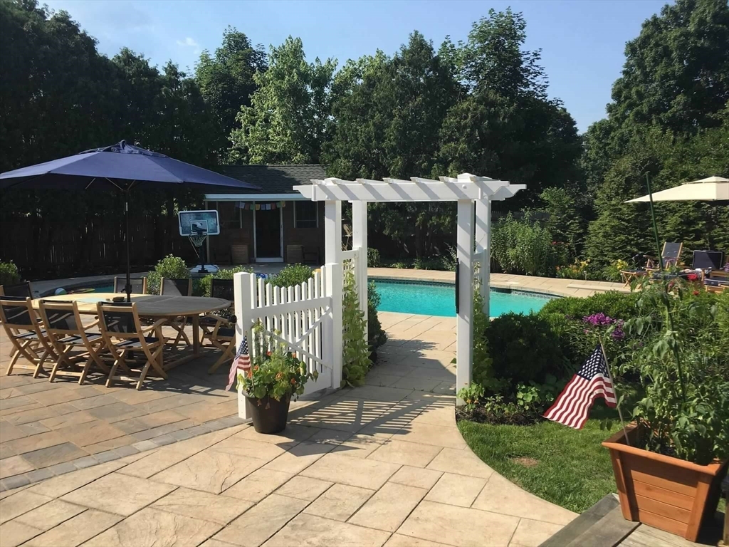 10 Spring Road Westborough, MA 01581 - Photo 30 of 42 a view of a house with backyard and sitting area