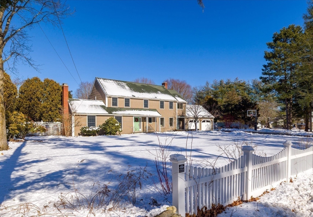 10 Spring Road Westborough, MA 01581 - Photo 39 of 42 a view of a white house with a big yard and large tree